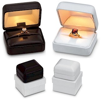 Lighted ring boxes in black and white.